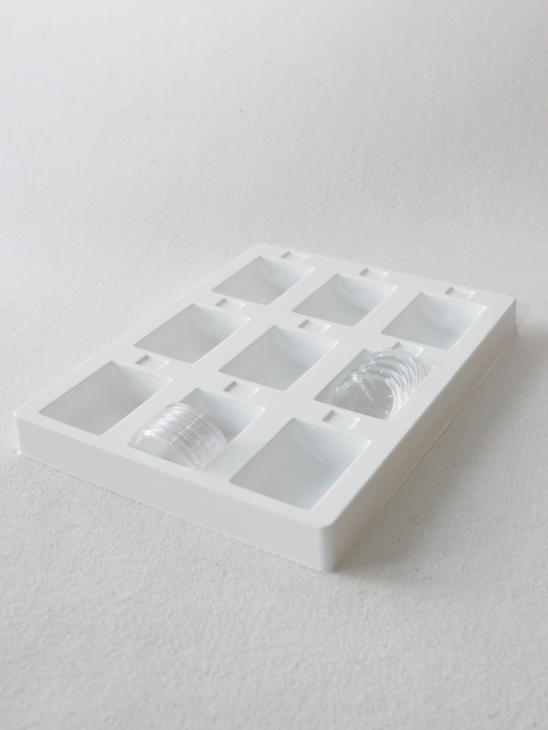 Пластиковый ложемент под набор капсул для монет