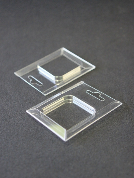 Блистер с загибом краев для капсул d-50 мм