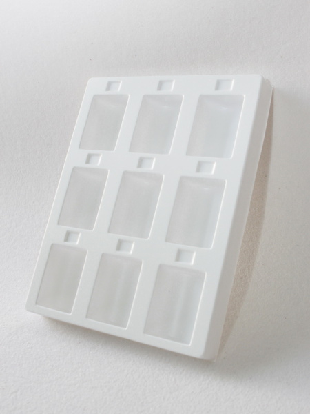 Пластиковый ложемент под набор капсул для монет